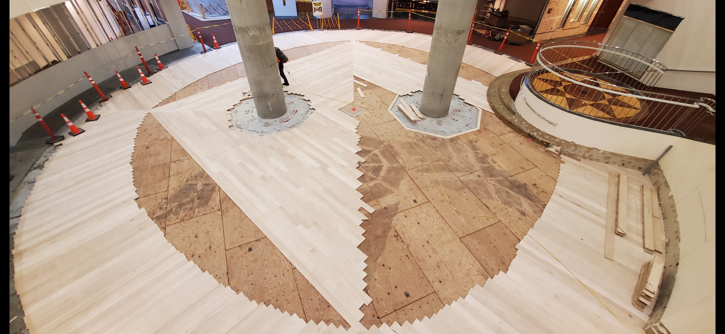 Curved hardwood installation at the BOA Lobby Rotunda